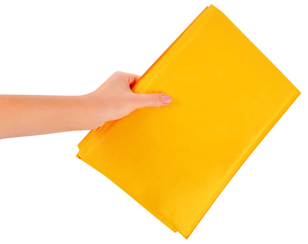 yellow postal packets in hand on a white background - Photo, Image