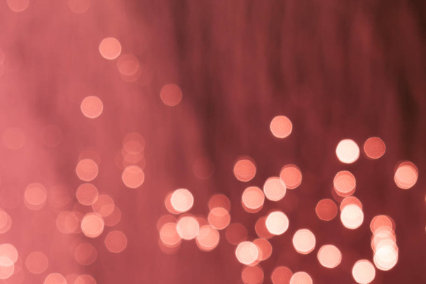 Blurred bright red background with abstract glowing round lights and bokeh - Photo, Image
