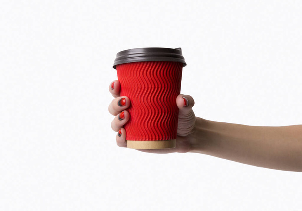 Females hand with red black ombre gradient nails hold paper cup - Photo, Image