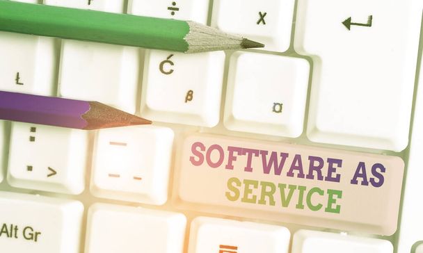 Conceptual hand writing showing Software As Service. Business photo text On Deanalysisd licensed on Subscription and centrally hosted. - Photo, Image