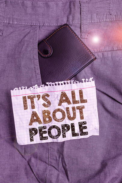 Writing note showing It S All About People. Business photo showcasing Public Society Entire Body of Persons a Community Small wallet inside trouser front pocket near notation paper. - Photo, Image