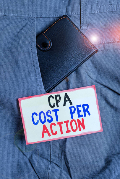 Conceptual hand writing showing Cpa Cost Per Action. Business photo showcasing Commission paid when user Clicks on an Affiliate Link Small wallet inside trouser front pocket near notation paper. - Photo, Image