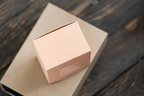 Two gift boxes, blush coral color and craft paper. - Photo, Image