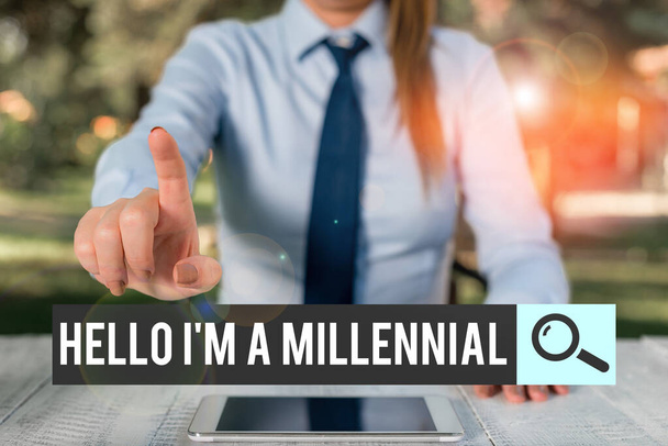 Handwriting text writing Hello I M A Millennial. Concept meaning demonstrating reaching young adulthood in current century Female business person sitting by table and holding mobile phone. - Photo, Image