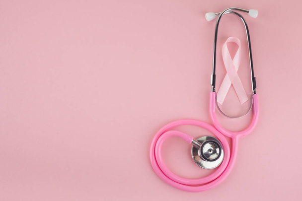 Pink ribbon and stethoscope on pink background, Symbol of breast cancer in women, Health care concept - Zdjęcie, obraz