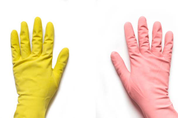 Дві руки в рожевих і жовтих гумових латексних рукавичках на білому фоні
 - Фото, зображення
