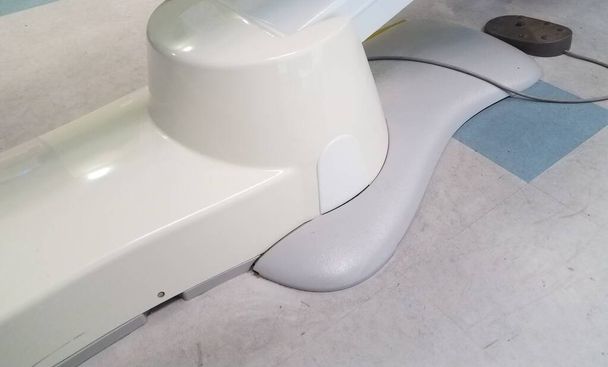 white tile floor with dentist chair and foot plate - Photo, Image
