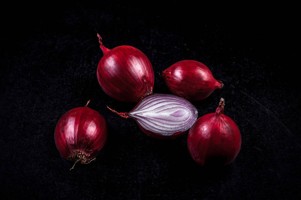 Four purple bulbs on a black background - Foto, afbeelding