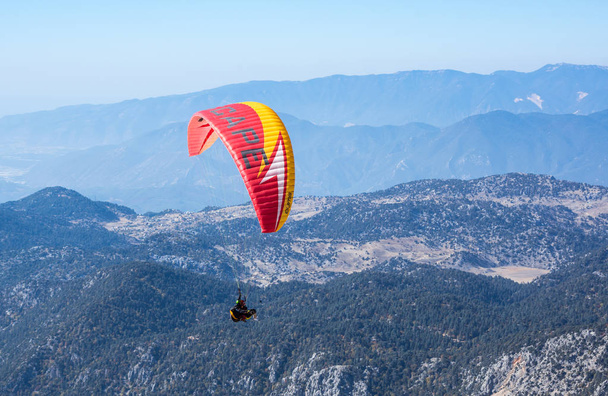 Paraglider flying over mountains - Fotó, kép