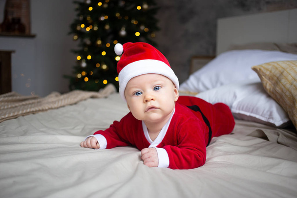 Beautiful little baby celebrates Christmas. New Year's holidays. - Foto, Imagen