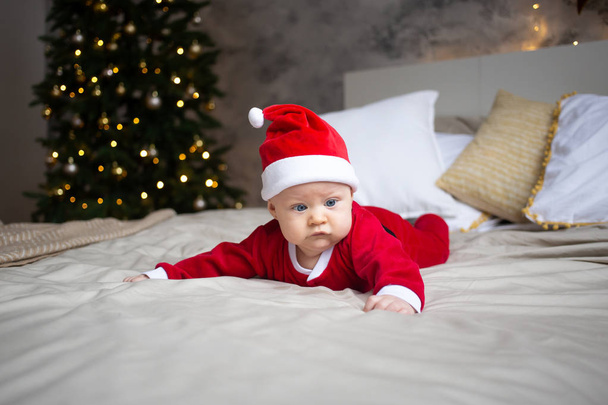 attractive baby boy in Christmas costume at home - Φωτογραφία, εικόνα