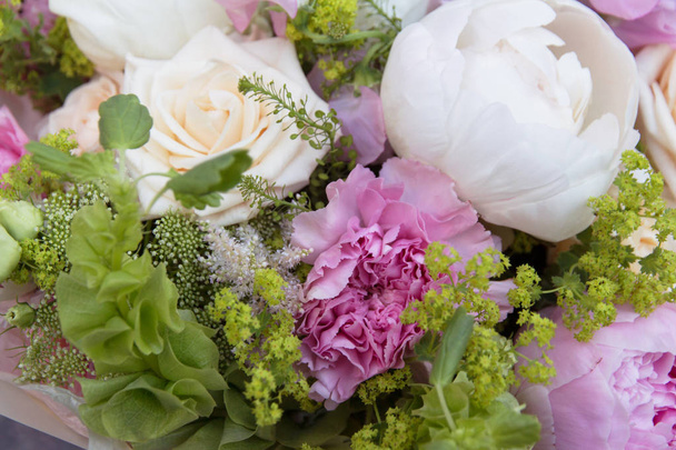 White pink bouquet with peonies, carnation and roses closeup, floral background - Foto, Imagem