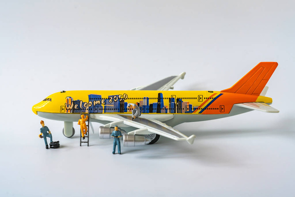 Close up miniature airplane and technicians maintenance and chec - Фото, изображение