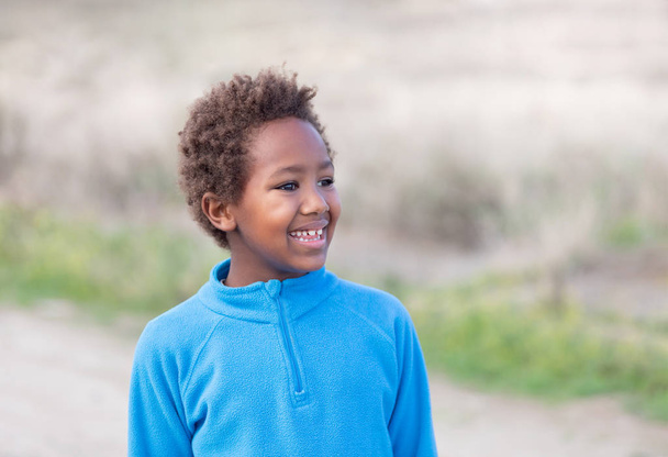 Happy african child with blue jersey - Fotografie, Obrázek