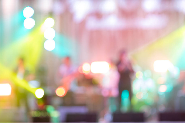Rock concert light background illumination. Defocused of the show on stage.  blurry image background of musicians rock in big rock concert.Blurred of mini concert in night club or bar. - Φωτογραφία, εικόνα