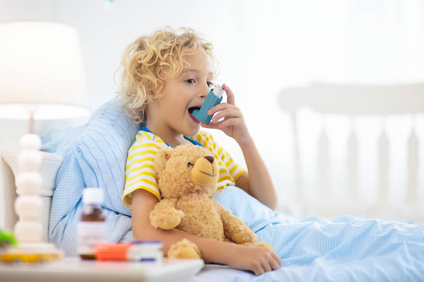 Sick little boy with asthma medicine. Ill child. - Photo, Image