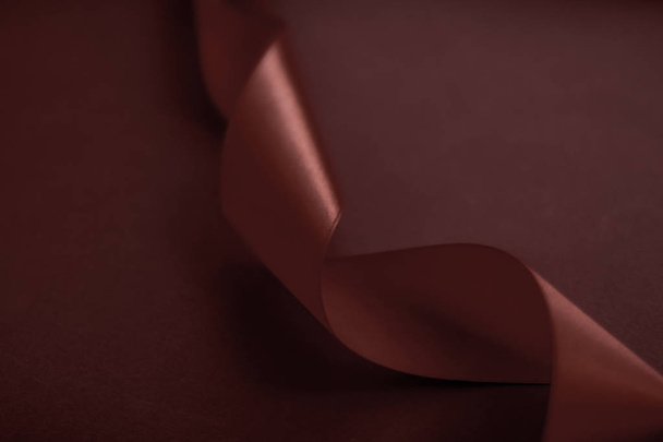 Abstract silk ribbon on chocolate background, exclusive luxury b - Photo, Image