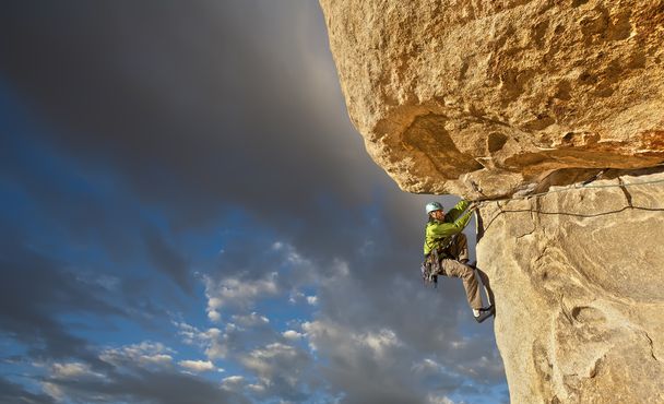 Climber struggles up a cliff. - Photo, Image