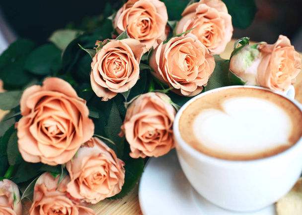 cup of cappuccino and roses for breakfast - Foto, imagen