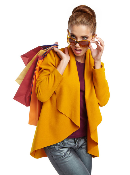 Autumn woman with shopping bags. Studio shoot - Zdjęcie, obraz