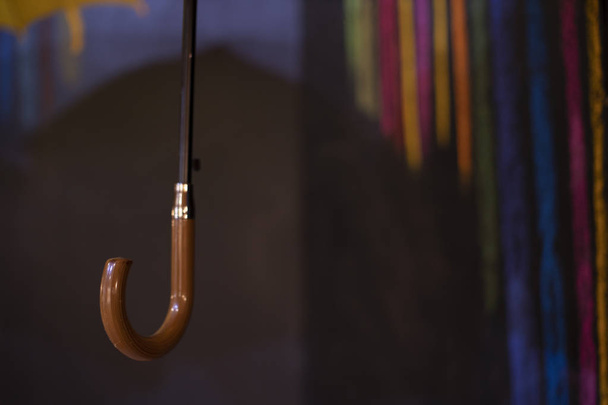 umbrella handle soft focus interior object in dark room unfocused background environment  - Photo, Image