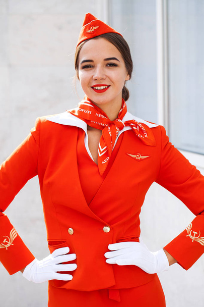 RUSSIA, SAMARA: 08 AUGUST 2019. Sexy stewardess dressed in offic - Fotografie, Obrázek