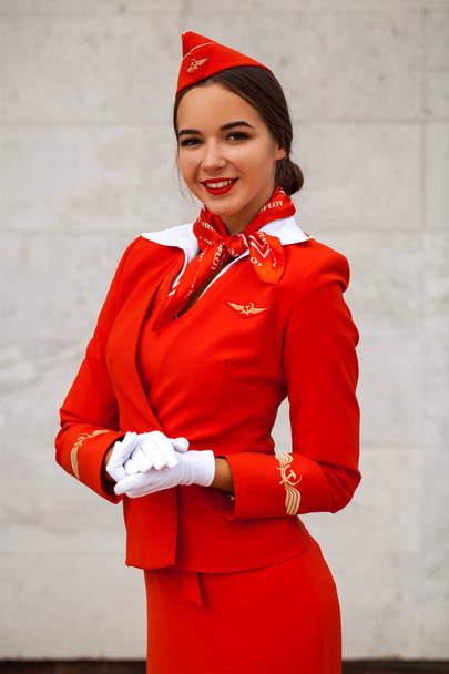 RUSSIA, SAMARA: 08 AUGUST 2019. Sexy stewardess dressed in offic - Foto, afbeelding