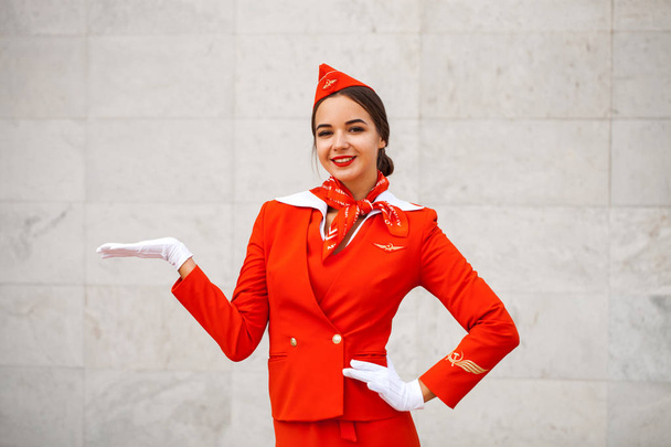 RUSSIA, SAMARA: 08 AUGUST 2019. Sexy stewardess dressed in offic - 写真・画像
