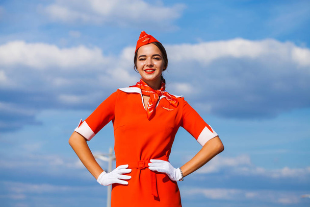 RUSSIA, SAMARA: 08 AUGUST 2019. Sexy stewardess dressed in offic - Фото, изображение
