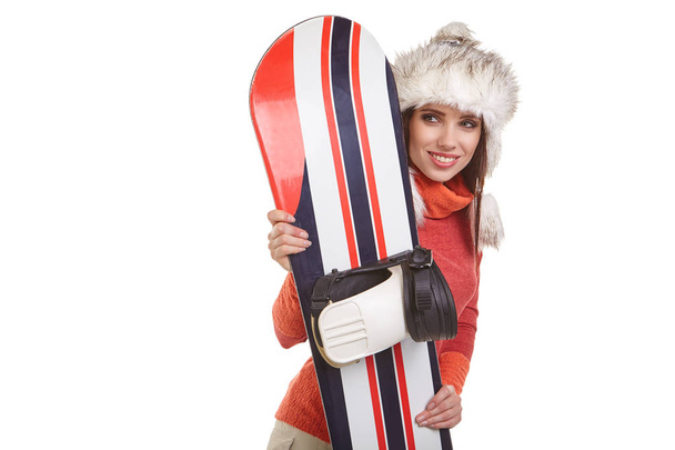 a beautiful sexy woman with a snowboard in studio - 写真・画像