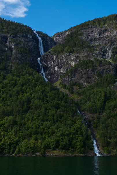 waterfall on edge of the Aurlandsfjord - unesco enlisted natural heritage site - in Norway - Foto, Imagem