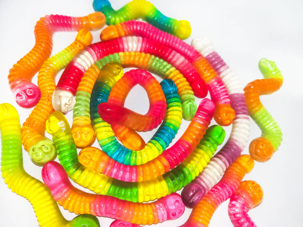 Multicolored jelly, sweets in shape of worm . Top view. Sweet background - Zdjęcie, obraz