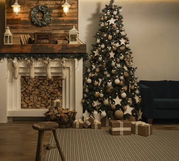 Design room with Christmas tree, sofa and the fireplace. Interior eco style. Christmas decorated interior of couch and Christmas tree, modern and cozy. happy new year and merry christmas - Photo, Image