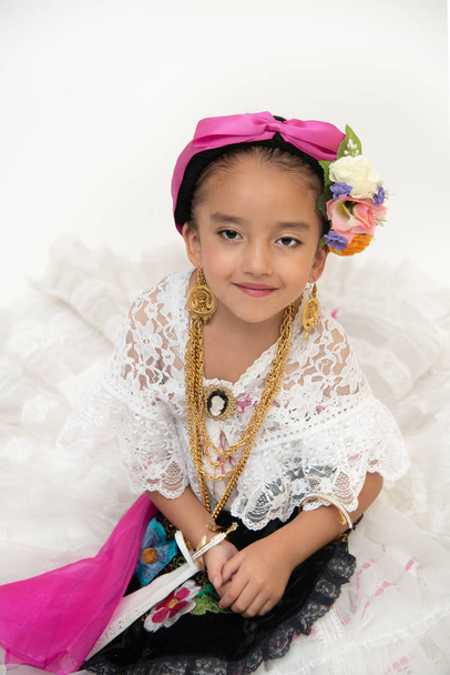 Little Mexican dancer girl dressed in a traditional folk costume of the state of Veracruz Mexico - Photo, Image