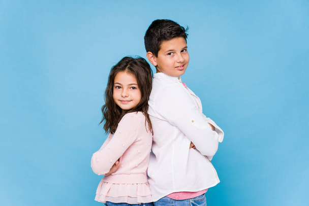 Little brothers against a blue background - Photo, Image