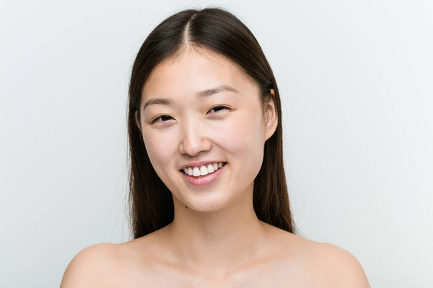 Close up of a young beautiful and natural asian woman - Fotó, kép