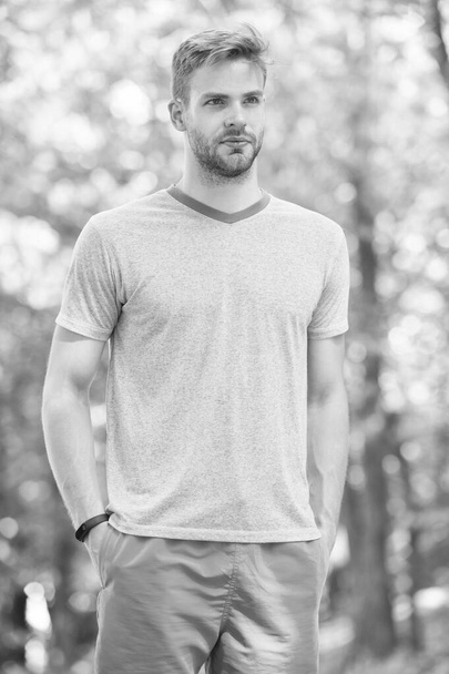 Sport coach. Sport is way of life. Sportsman lifestyle. Handsome athlete in park. Sport wellbeing and self care. Handsome man sporty outfit look confident. Male beauty. Guy handsome bearded face - Fotoğraf, Görsel