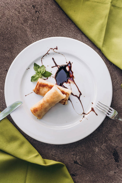 Breakfast. Pancakes with chocolate, cottage cheese, condensed milk on a dish.  - Valokuva, kuva
