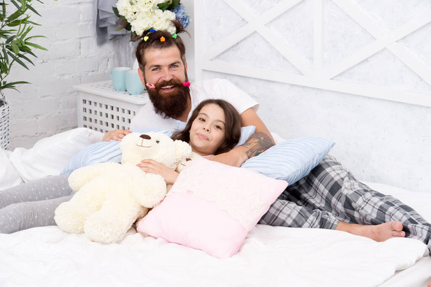 Family traditions. good night. funny pajama party. small girl with bearded father in bed. weekend at home. father and daughter having fun. family bonding time. i love my daddy. happy morning together - Fotó, kép