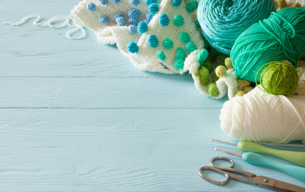 White crocheted fabric with color patterns. Bright aquamarine, b - Foto, Imagem