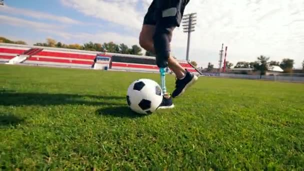 Paralympian is playing football in slow motion - Кадри, відео