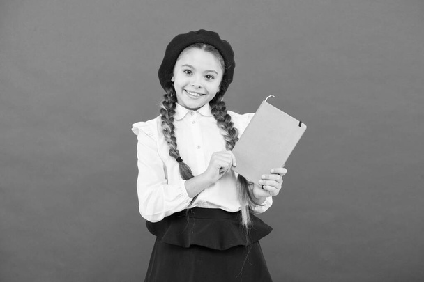 Preparing activity book writing. Reading skills. Study language. Interesting story. Adorable little girl with school exercise book. Achieve knowledge. Education concept. Cute small child holding book - Photo, image