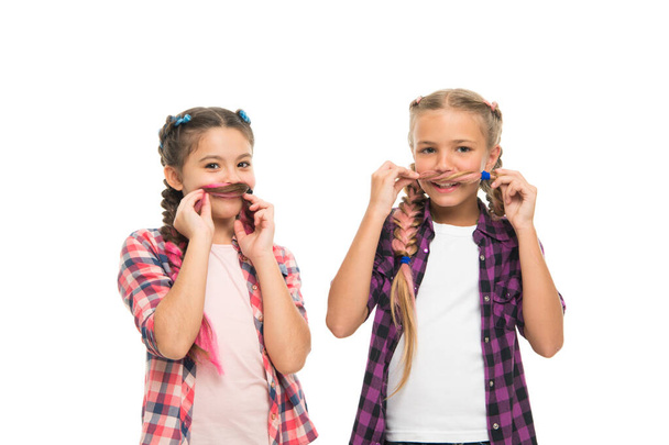 Whose mustache better. Little girls wear plaited hairstyles. Happy girls have hair fun. Cute girls smile with funny look. Small girls in casual style isolated on white. Fashion and beauty - Fotoğraf, Görsel