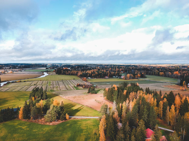 Aerial view of fertile plowed fields and forests. Photo taken from a drone. Finland, Pornainen. - Valokuva, kuva