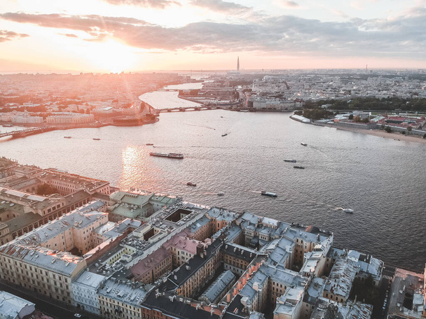 Aerial photo of the Neva river in the sunset light. River boats,. Russia, St. Petersburg - 写真・画像