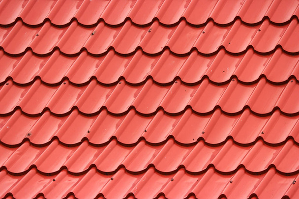 Thai red ceramic roof wall background. - 写真・画像