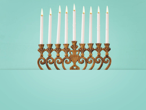 Religion image of jewish holiday Hanukkah background with menorah (traditional candelabra) and candles - Photo, image