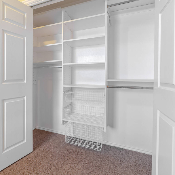 Square Empty white built in closet or wardrobe interior - 写真・画像