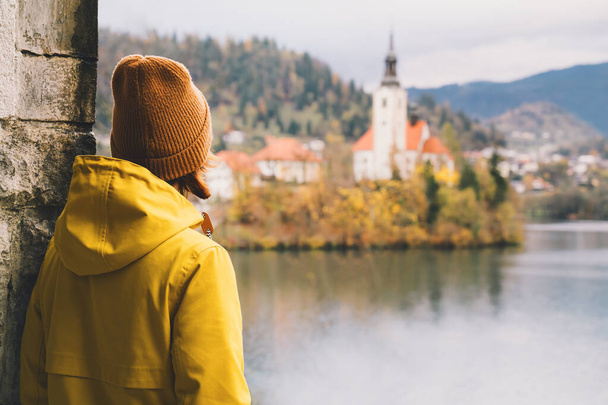 Traveling tourist looking at Bled Lake, Slovenia, Europe.  - 写真・画像
