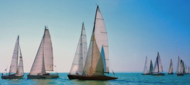 Sailboats in open beautiful blue water  - Фото, изображение
